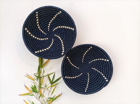 Wall Basket Blue Set of 2, Large African Wall Basket, Boho Decor, African Wall Basket, Boho Wall Hanging  Diameter: 12 inches (30.4cm) each The wall baskets  are intricately woven making beautiful patterns, each one comes with loop at the back to make it easy for wall hanging. They can also can be used as a centerpiece  or display for dining / coffee table These african wall baskets will brighten up your living space and add the bohemian touch to your home decor. GREAT GIFT IDEA for housewarming, birthdays. Ideally for those who love something natural and boho chic or a friend who loves interior design. it's also a perfect self gift!  Handmade by skilled women artisan from Rwanda with 100% natural and sustainable raw materials - sisal,wild grass and natural dye made from tree bark roots an Basket Walls Boho Living Room, Basket Walls Boho, Basket Walls, African Baskets Wall, Woven Wall Baskets, Basket Blue, Basket Boho, African Wall Baskets, Colorful Baskets