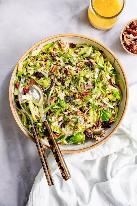 Brussels Sprout Slaw Recipe Brussels Sprout Slaw, Brussel Sprout Slaw, Maple Dressing, Shredded Brussels Sprouts, Food Processor Uses, Slaw Recipe, List Of Vegetables, Shredded Brussel Sprouts, Vegan Salads