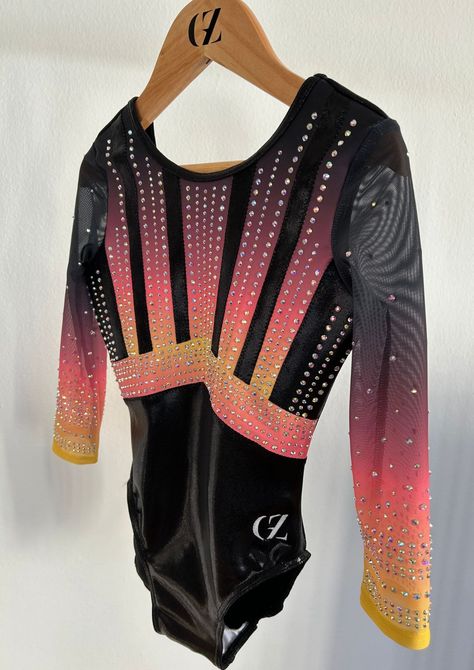 Discover Mira, the beautiful lined leotard full of rhinestones for a strong shiny look. The leotard is made of black mystic fabric, and mat sublimated lycra. The sleeves are made of mesh for an elegant look. Preppy Gymnastics Leotards, Gymnastics Vibes, Long Sleeve Gymnastics Leotards, Gymnastics Apparel, Ootd Gym, Black Mystic, Leotards Gymnastics, Gymnastics Competition Leotards, Leotard Gymnastics