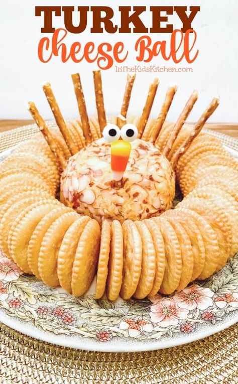 This Turkey Cheese Ball is a super cute Thanksgiving appetizer that takes just minutes to assemble with our shortcut recipe! #appetizers #Thanksgiving | Thanksgiving Day Snacks | Thanksgiving Treats for Kids | Thanksgiving Day Foods | Kid Friendly Ideas | Turkey Themed Treats | Thanksgiving Recipes for Kids | Thanksgiving Food for Children | Thanksgiving Day Party Dishes Kid Friendly Thanksgiving Recipes, Thanksgiving Recipes Turkey, Cheese Logs, Turkey Veggie Tray, Friendsgiving Appetizers, Turkey Cheese Ball, Kid Friendly Thanksgiving, Best Thanksgiving Appetizers, Thanksgiving Appetizers Easy