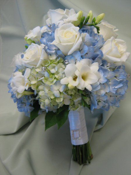 blue hydrangea wedding centerpieces | Blue hydrangea, white roses and fressia with crystals. Hydrangea Centerpiece Wedding, Blue Hydrangea Wedding, Hydrangea Bouquet Wedding, Blue Wedding Centerpieces, Wedding Flowers Hydrangea, Wholesale Flowers Wedding, Hydrangea Centerpiece, Blue And White Flowers, Hydrangea Bouquet