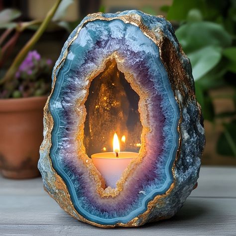 The Geode Candle is a stunning, nature-inspired piece that combines the beauty of crystals with the warmth of candlelight. Shaped like a real geode, the outer surface mimics the rugged texture of stone, while the inside reveals intricate, crystal-like formations that sparkle when illuminated. Hand-poured with premium, long-lasting wax, each candle boasts a unique, gemstone-like appearance, offering a blend of art and ambiance. As the candle burns, it casts a soft, radiant glow, creating a soo... Crystal Shaped Candles, Geode Candle Holder, Under Shelf Lighting, Geode Candle, Luxurious Candles, Rock Projects, Nightstand White, Textured Blankets, Decor Market