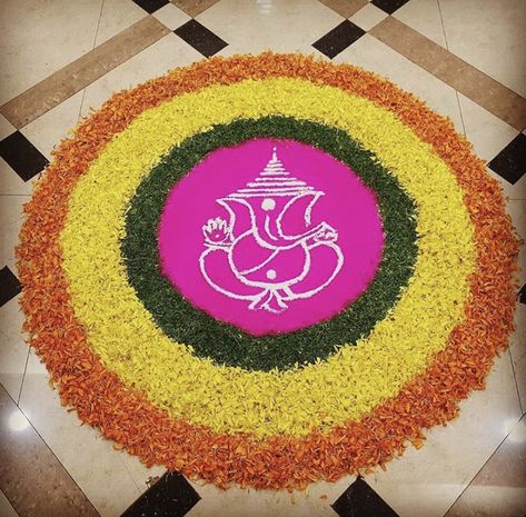 Ganesha Rangoli using flower petals Pooja Table, Ganpati Rangoli, Floral Rangoli, Flower Rangoli Designs, Ganesh Rangoli, Ganesha Rangoli, Ganesh Pooja, Pookalam Design, Simple Flower Rangoli