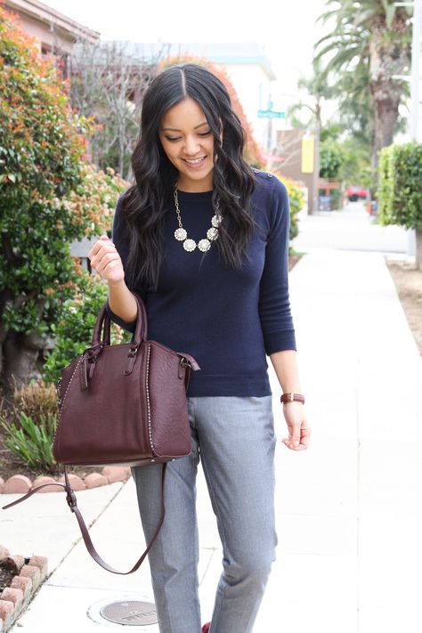 business casual outfit: Grey Pants with Navy Sweater and Maroon Pumps with Medallion Necklace Closeup Dark Grey Pants Outfit For Work Women, Dark Blue Pants Outfit Work, Navy Pants Outfit Women, Navy Top Outfit, Navy Blue Sweater Outfit, Navy Blue Shirt Outfit, Navy Cardigan Outfit, Grey Dress Pants Outfit, Navy Sweater Outfit