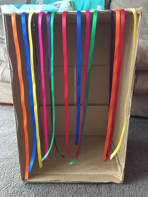 Ribbon Box Baby Play. Do you have cardboard boxes lying… | by Heidi LearningThroughPlay | Learning Through Play Sensory Cardboard Box Ideas, Box Play Ideas, Morning Centers, Large Cardboard Boxes, Infant Room, Baby Sensory Play, Eyfs Activities, Ribbon Box, Fun Activities For Toddlers