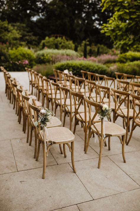 Outdoor seating area for summer wedding with the chairs decorated with pale pink rose chair back decor Seat Decorations Wedding Chairs, Backyard Wedding Chairs, Brown Wedding Chairs, Wedding Chair Deco, Outdoor Wedding Chairs, Chair Decoration Ideas, Wedding Chairs Diy, Rose Chair, Event Chairs