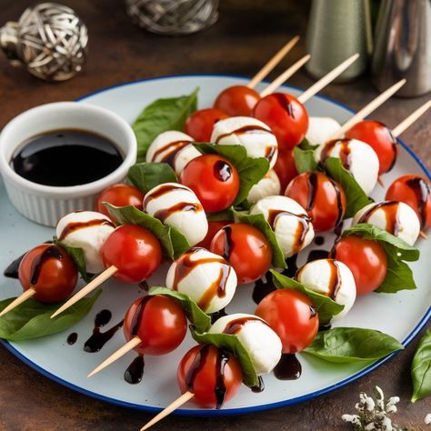 Caprese Salad Skewers Ingredients: - Cherry tomatoes - Fresh mozzarella balls - Fresh basil leaves - Balsamic glaze Method: 1. Thread cherry tomatoes, mozzarella balls, and basil leaves onto skewers. 2. Drizzle with balsamic glaze. Serving: Arrange on a platter with extra glaze for dipping. #caprese #salad #skewers #recipes #foodforfoodies #healthyfood #healthyfood Skewers Recipes, Tomato Skewers, Salad Skewers, Caprese Salad Skewers, Mozzarella Balls, Tomatoes Mozzarella, Caprese Skewers, Healthy Lifestyle Food, Rabbit Baby