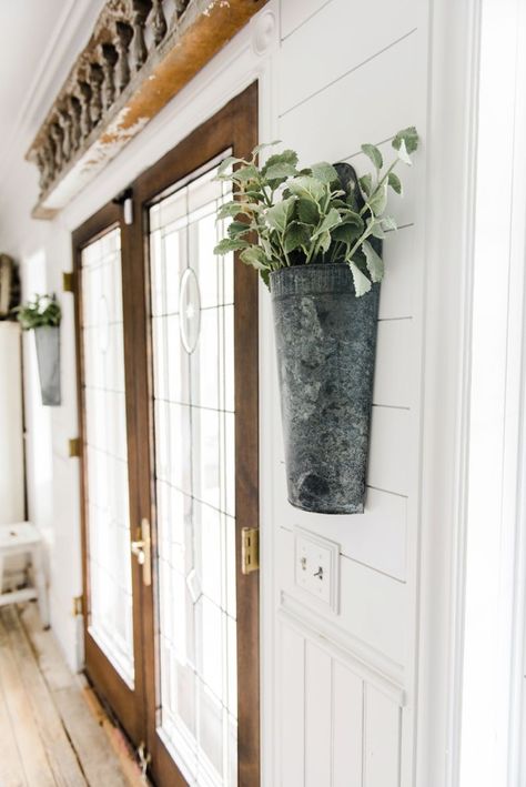 Hanging metal vases with flowers hanging on each side of the french doors. Great farmhouse decor style tips & tricks. A must pin for cottage style and farmhouse style decor. Metal flower vases from Magnolia Market Farmhouse Ideas, Metal Vase, Wall Vase, Country Style Homes, Country Farmhouse Decor, Country House Decor, Farmhouse Style House, Farmhouse Wall Decor, Farmhouse Style Decorating