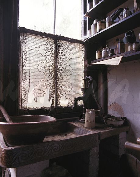 Lace curtain on window above earthenware sink in Victorian kitchen Lace Kitchen Curtains Above Sink, Kitchen Curtains Above Sink, Lace Kitchen Curtains, Above Sink, Lace Curtain, Victorian Kitchen, Lace Curtains, Kitchen Curtains, Sink In