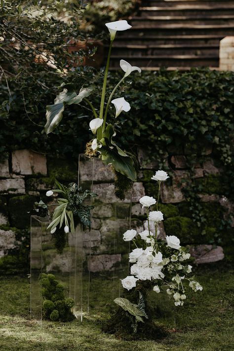 A Garden Soirée Plant Altar Wedding, Hanging Flower Alter, Green Florals For Wedding, White Chair Ceremony, Minimalist Wedding Altar Outdoor, Wedding Ceremony Pedestals, Wedding Alter Backdrops, Green And White Wedding Florals, Unique Wedding Alter