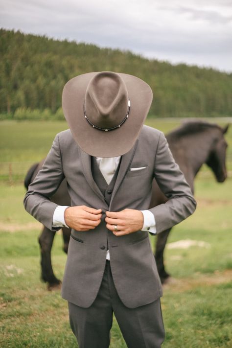 Rustic wedding styled , whitefish Montana destination wedding. Goormsmen suite, ranch wedding Tan Suit Cowboy Wedding, Cowboy Hat And Suit Wedding, Groomsman Cowboy Hat, Western Wedding Photography, Black Cowboy Hat Wedding Grooms, Western Groomsmen Attire Grey, Khaki Groomsmen, Brown Tux, Khaki Wedding