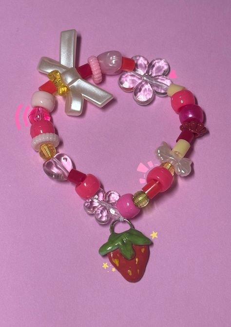 This is a durable beaded bracelet with an adorable handmade strawberry polymer clay charm. It is 19cm and stretches comfortably to 24cm. This bracelet stretches easily and uses elastic cord for a bracelet string that lasts years. Strawberry Kandi, Kandi Jewelry, Bracelets Kandi, Kawaii Bracelet, Bracelet String, Candy Bracelet, Beaded Things, Resin Bracelet, Kandi Bracelets