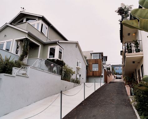 The restored original and new addition. After a brief tussle over access to their shared driveway (resulting in what Bornstein calls a “spite fence”), most of the occupants in the apartment building next door appreciate having a family as neighbors, rather than another big box to block their light and views. Driveway Divider Ideas, Shared Driveway Divider Ideas, Shared Driveway Divider, Driveway Divider, Budget Renovations, Driveway Inspiration, Shared Driveway, Driveway Ideas, Rental House