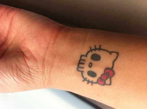 Cute But Edgy Tattoos, Small Tattoos Hello Kitty, Small Cute Skull Tattoos, Hello Kitty Simple Tattoo, Emo Skull Tattoo, Y2k Tattoo Ideas Hello Kitty, Hello Kitty Skull Tattoo, Hello Kitty Couple Tattoo, Tiny Emo Tattoos