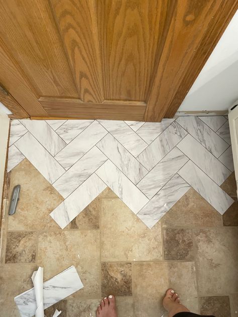 Marble look peel and stick tile Marble Peel And Stick Tile Bathroom, Bathroom Tile Peel And Stick, Herringbone Stick On Tile, Bathrooms With Peel And Stick Tile, Vinyl Peel And Stick Tiles, Entryway Peel And Stick Tile, Tile Floor Upgrade Diy, Pile And Stick Tile Bathroom, Peel And Stick Floor Tile Entryway