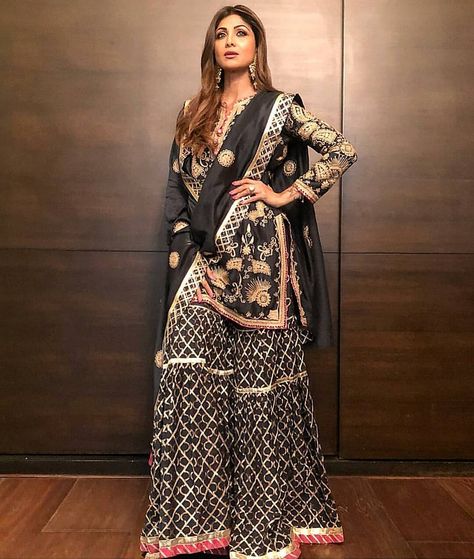 #StyleQuote : "Elegance is the only beauty that never fades" In black and gold is @theshilpashetty spreading her elegance at Baba Siddiqui iftaar party, she just makes us sing the song "Mein aayi hoon UP Bihar lootne" again and again! 😍 She featured in an Simar Dugal outfit, with amazing golden work on it, this outfit just embraces her personality! Checkout the complete collection on her official #instagram page @simardugal ⠀⠀⠀⠀⠀⠀⠀⠀⠀⠀⠀⠀ ⠀⠀⠀⠀⠀⠀⠀⠀⠀⠀⠀⠀ #shilashetty #shillashettykundra #bollywoo Golden Sharara, Plazzo Suits, Shilpa Shetty, Bollywood Outfits, Sharara Set, Indian Designer Outfits, Designer Dresses Indian, Desi Fashion, Indian Designer Wear