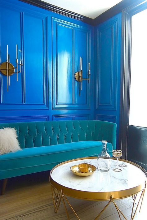 Elevate your living room decor with this chic blue panel wall and teal sofa combination. The gold accents and modern side table add a touch of luxury. Transform your space with bold colors and elegant design. #LivingRoomDecor #InteriorDesign #HomeDecor Blue Panel Wall, Teal Sofa, Blue Living Room Decor, Blue Panels, Perfect Living Room, Panel Wall, Blue Living Room, Modern Side Table, Furniture Arrangement