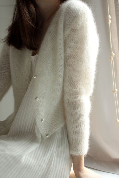 This bridal cardigan will be MADE IN YOUR SIZES by my hands. It is extremely soft, fluffy and warm sweater because it's 2 strands of kid mohair and silk. Best option for autumn, winter and spring wedding. It's simple and elegant. ABOUT BoWoolę The accuracy and quality of my clothes is paramount. I use the highest quality wool yarn, because I prefer natural fabrics. I knit each piece as I'd made it for myself. I ship from Poland, Europe, but I get inspiration from all the world. Wedding Dress With Cardigan, Bridal Cardigan, White Crochet Cardigan, Wedding Sweater, Wedding Cardigan, Pull Mohair, Fluffy Cardigan, Baby Cardigan Pattern, White Knit Cardigan