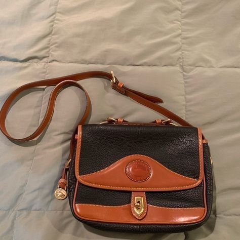 What You See Is An Authenic Classic Style Vintage Dooney&Bourke Carrier Shoulder Bag. Pebbled Blue Leather With Brown Leather Trim. Top Suitcase Handle Crossbody Adjustable Strap Measures 12” Across & 8.5” Top To Bottom, Not Including Top Handle In Measurement. Paperwork Includes A Stamp From Sept 2001. This Bag Has Never Been Used. Purchased At Estate Auction House. Converse Classic, Suitcase Handle, Barrel Bag, Vintage Leather Bag, Croc Leather, Brown Leather Shoulder Bag, Ostrich Leather, Trim Top, Leather Hobo Bag