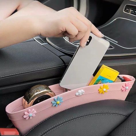 : Keep your car seat tidy and organized with this stylish and functional organizer. Perfect for storing snacks, toys, and other essentials, this organizer is made with durable materials and features a floral design that will add a touch of beauty to your car. #carseatorganizer #carseataccessories #flowers Car Stuff Aesthetic, Diy Car Camping Hacks, Car Interior Diy Ideas, Cute Stuff For Your Car, Fun Car Decor, Cute Car Essentials, Teen Car Accessories, Stuff To Put In Your Car, Car Things For Girls Ideas