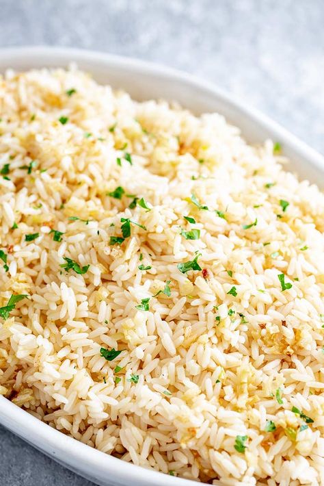 This Garlic Butter Rice is such a simple dish that goes with anything. White rice is cooked with garlic butter for an easy rice side that takes under 20 minutes! Serve it with your favorite main course for a side dish the whole family will love! It reheats well, so leftovers are perfect for lunch! Rice Sides For Salmon, Rice Side For Salmon, Leftover Rice Pilaf Recipes, Savoury Rice Recipes Simple, Rice For Salmon, Boiled Rice Recipes, Garlic Rice Pilaf, Savoury Rice Recipe, Shrimp Side Dish