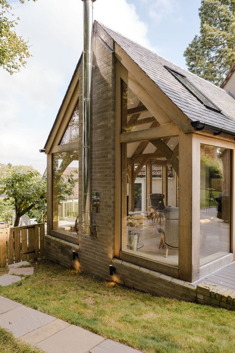 We are thrilled to present our recently completed Green Oak Frame Extension in Ceres, Fife. The oak frame design allowed us to incorporate an abundance of glass, not only flooding the space with natural light but also seamlessly connecting the indoors with the outdoors, bringing the surrounding trees right into the heart of the extended house. The weathered wood exterior also complements the existing harling of the house beautifully. Grand Designs Houses Uk, Timber Framed Extension, Country House Extension, Red Sandstone House, Sunroom Extension, Retirement Cottage, Timber Frame Extension, Grand Designs Houses, Bungalow Conversion