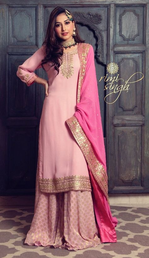 Masakali... Masakali... Masakali Spring Summer 2019 Rose pink pure georgette kurta paired with a matching georgette bootie sharara and a darker pink dupatta. There is gota hand embroidery on the neckline, sleeve and the kurta edge and four sides of the dupatta. Available exclusively at Rimi Singh Studio A 999 Sushant Lok 1 Gurgaon #9818310054 Pink Plazo With Kurti, Pink Duppta Combination, Pink Garara Dress, Baby Pink Indian Outfit, Dark Pink Suits Women Indian, Baby Pink Suit Indian, Dark Pink Kurti Combination, Pink Suits Women Indian, Plain Sharara