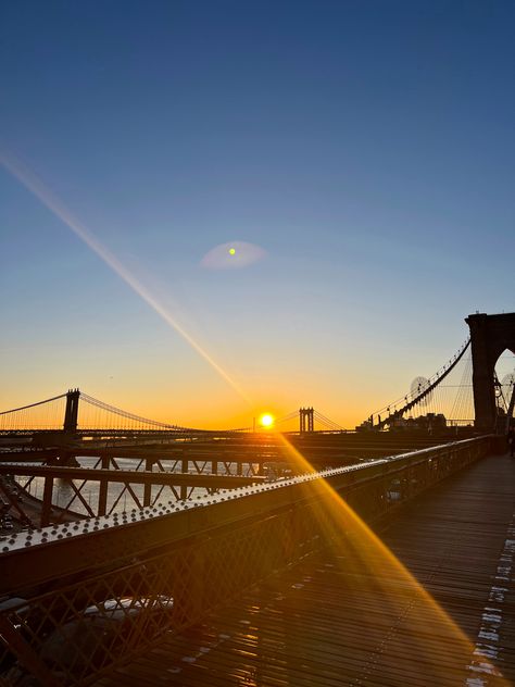 This is your sign to get up early and walk the Brooklyn Bridge at sunrise in New York City Sunrise Brooklyn Bridge, New York Sunrise, Sunrise Images, Get Up Early, Finally Friday, Sunny Morning, Getting Up Early, Travel Places, Brooklyn New York