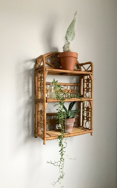 Wicker wall shelf Vintage Shelves Bedroom, Small Wicker Shelf, Funky Shelves, Wicker Wall Shelf, Cost Bedroom, Plant Shelf Wall, Bookish Bedroom, Rattan Wall Shelf, Rattan Shelf