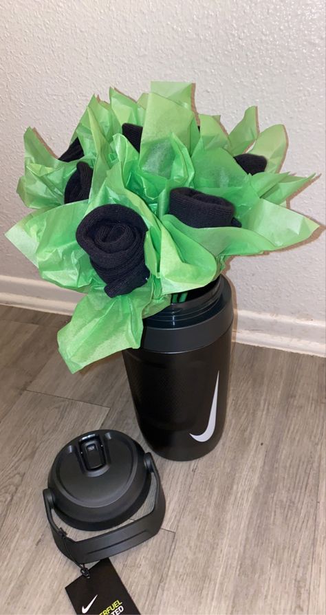 For him gift ideas
Black Nike socks 🧦 
Nike water jug 
Tissue paper Sock Bouquet, Diy Socks, Nike Socks, Water Jug, Socks, Nike, Water, Gifts