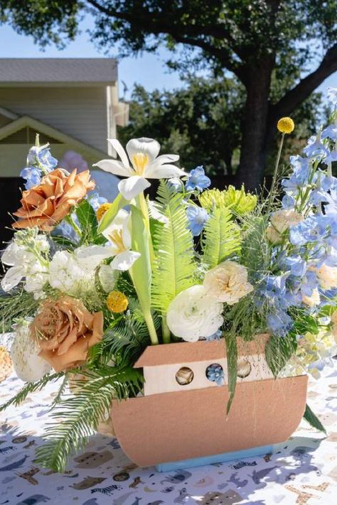 Feast your eyes on this stunning Noah's ark-themed baby shower! The floral centrepiece is wonderful!! See more party ideas and share yours at CatchMyParty.com Noahs Ark Shower Ideas, Noah’s Arch Theme Birthday, Noahs Ark Party Theme, Noah's Ark Party Decorations, Noahs Arc First Birthday, Noah’s Ark First Birthday, Noah's Ark Baby Shower Decorations, Noahs Ark Centerpiece Ideas, Noah’s Ark Decorations