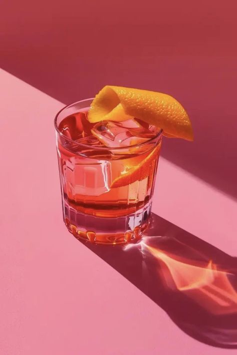 Realistic Photography, Bright Pink Background, Negroni Cocktail, Photography Still Life, Cocktail Photography, Colorful Drinks, Luxury Photography, Tumbler Glass, Deep Red Color