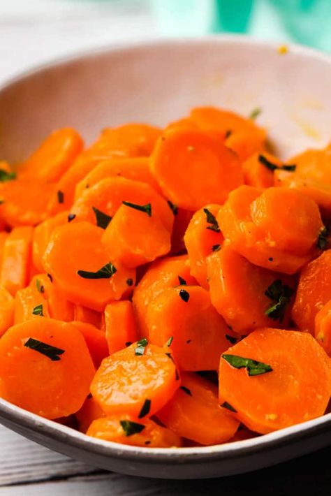 Buttery sautéed carrots are a quick and easy side dish that goes with so many things. With a hint of maple syrup (honey or brown sugar can be used instead) to enhance their natural sweetness, the rich taste of butter, and a squeeze of lemon juice to brighten it all up, this might become your new favorite way to make carrots. Boiled Carrots, Boil Carrots, Sauteed Carrots, Sauteed Green Beans, Glazed Pork Chops, Sauteed Zucchini, Roasted Chicken Breast, Cooked Carrots, Glazed Carrots