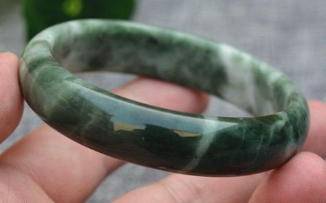 A jade bracelet is worn as a symbol of luck, wealth, healing, protection, and longevity. Learn more about its feng shui meaning, benefits and properties here. Bracelet Meaning, Symbol Of Luck, Bracelets With Meaning, Energy Cleanse, Reproductive System, Jade Bangle, A Symbol, Jade Bracelet, Jade Stone