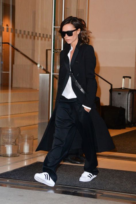 Who: Victoria Beckham  What: Adidas Track Pants  Why: The always-chic designer went for a laid back look that seems to be a hat tip to her sporty soccer-playing husband—adidas track pants and coordinating sneakers. Of course she paired them with an elegant cashmere coat.  Get the look now: Adidas pants, $45, adidas.com. Sporty Elegant Outfit, Style Victoria Beckham, Look Working Girl, Victoria Beckham Outfits, Yellow Sundress, Victoria Beckham Style, Kendall Jenner Outfits, Celebrity Design, Adidas Track