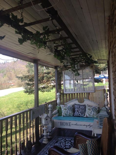 old antique wooden ladder hung from my  front porch roof I added greenery,lights and hung mason jars will post a picture of it at night Front Porch Roof, Ladder With Lights, Cabin Projects, Antique Ladder, Hanging Ladder, Diy Ladder, Hanging Mason Jars, Greenery Decor, Porch Roof