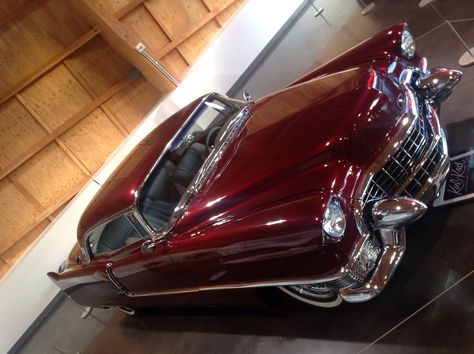 A 1955 Cadillac Coup Deville, in a candy apply red. Aesthetic Vehicles, Dracula Wife, Wine Red Car, Dark Red Car Aesthetic, Red Convertible Aesthetic, Cherry Red Convertible, Cherry Wallpaper, Red Cadillac, Vintage Red Car Aesthetic