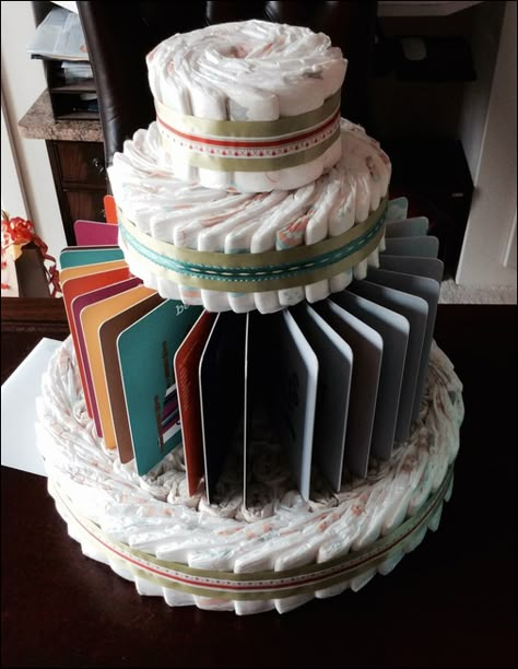 book-themed diaper cake #bookdiapercake #babyshower #bookbabyshower Diaper Cake Alternative, Book Themed Baby Shower Ideas, Baby Book Shower, Diy Diaper Cake, Cake Centerpieces, Diaper Gifts, Storybook Baby Shower, Diaper Cake Ideas, Baby Shower Diaper Cake