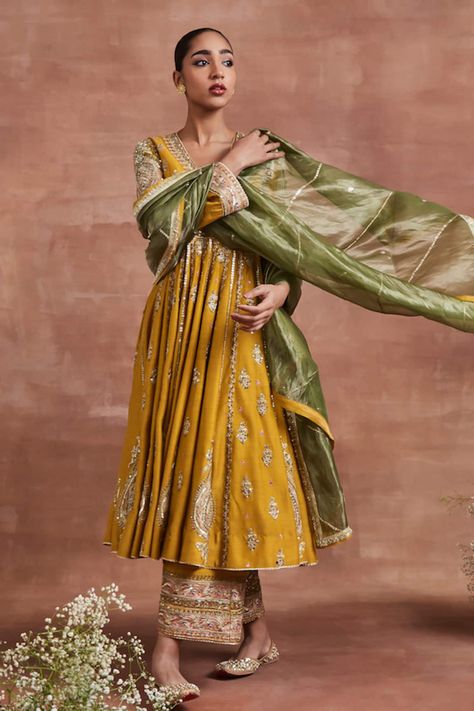 Buy Yellow Moonga Silk And Roop Zari Anarkali Palazzo Set For Women by Sue Mue Online at Aza Fashions. Navratri Silk Anarkali Set With Dabka Details, Yellow Slub Silk Dupatta With Dabka Work, Traditional Silk Anarkali Set With Gota Work, Bollywood Style Gold Slub Silk Anarkali Set, Dabka Silk Anarkali Set For Navratri, Silk Anarkali Set With Dabka For Navratri, Designer Anarkali Dupatta With Traditional Drape, Yellow Slub Silk Anarkali Set With Dupatta, Designer Wear Anarkali Dupatta With Traditional Drape