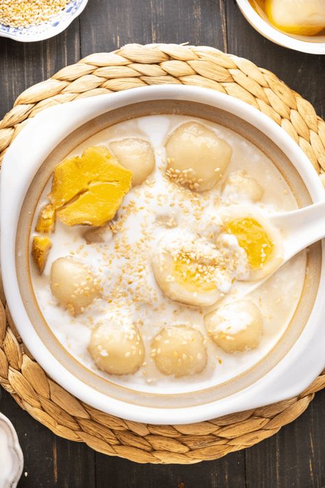 When you're craving something sweet, these Vietnamese Glutinous Rice Balls with Ginger Syrup will hit the spot! They're bite-sized parcels of love, perfect for family celebrations or those special in your life. #glutinousriceballs #gingersyrup #mungbeanpaste #tet #vietnamesenewyear #vietnamesefood #asiandessert Glutinous Rice Balls Recipe, Tet Food, Vietnamese Sweets, Rice Ball Recipe, Asian Baking, Glutinous Rice Balls, Vietnamese Desserts, Vietnamese Rice, Vietnamese Dessert