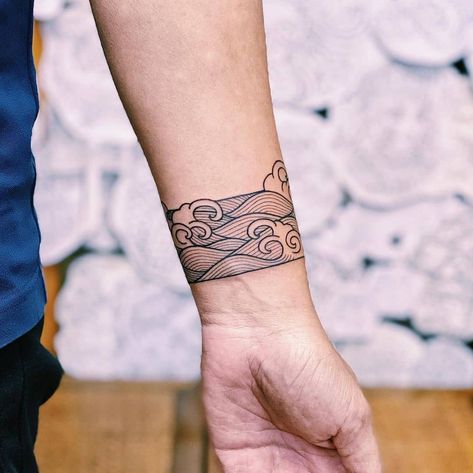 35+ Exquisite Line Art Tattoo Ideas Line Art Waves Tattoo, Wave Tattoo Around Wrist, Armband Pattern Tattoo, Ocean Wave Tattoo Sleeve, Line Art Leg Tattoo, Waves Arm Tattoo, Water Arm Band Tattoo, Beach Band Tattoo, Arm Band Tattoo Waves