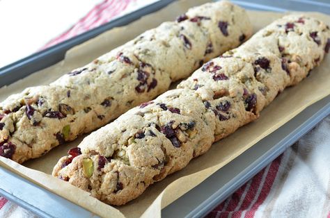 Orange Biscotti with Cranberries and Pistachios Cranberry Orange Pistachio Biscotti, Cranberry And Pistachio Biscotti, Cherry Pistachio Biscotti Ina Garten, Ina Garten Cherry Pistachio Biscotti, Cranberry Orange Biscotti, Pistachio Biscotti Recipe, Pistachio Spice Biscotti, Orange Biscotti, Orange Pistachio