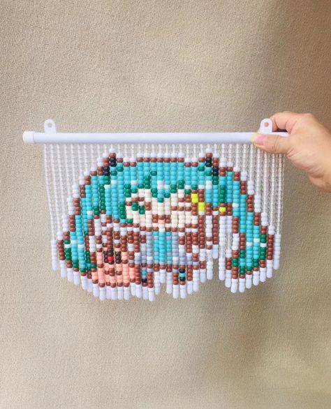 Beaded curtains are a type of decorative item that consists of strings of beads hanging from a rod or a frame. They can be used as a door or window cover, or as a room divider. Beaded curtains can have various patterns, colors, and shapes, depending on the beads used and how they are arranged.To make the beaded curtain with Hatsune Miku design, you need beads of different colors: white, blue, red, brown, pink, yellow, green, gray and black. #diy#Hatsune Miku Hatsune Miku Design, Beaded Curtains Diy, Miku Design, Bead Curtain, Beaded Curtain, Beaded Curtains, Diy Curtains, Aesthetic Hair, Window Coverings