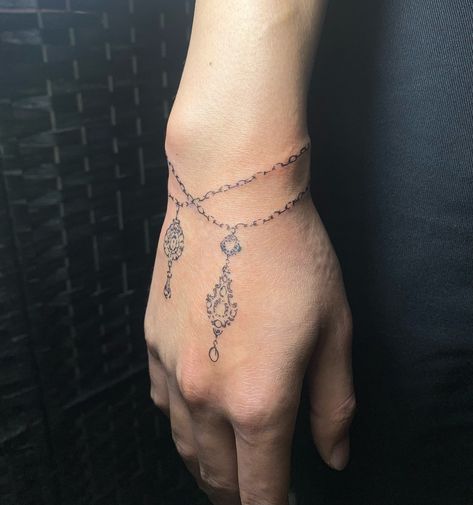 reeze 🕊️ | Bracelet + charms decor for Dylan 🤍 Such a fun placement to do thank you so much !! | Instagram Bracelet Hand Tattoo, Charm Bracelet Tattoo For Women, Bracelet Placement, Braclet Tattoo, Charm Bracelet Tattoo, Piercings Ideas, Bracelet Tattoo, Tattoo Bracelet, Bracelet Charms