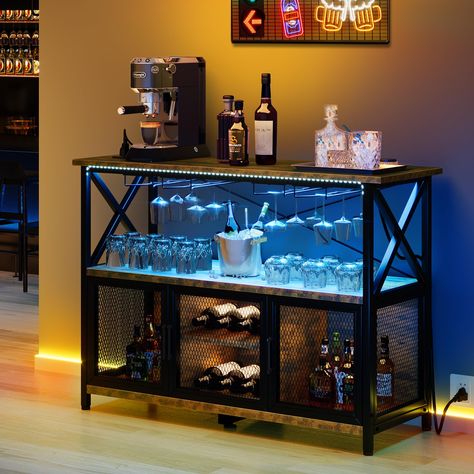 PRICES MAY VARY. LED-Lit Wine Bar Cabinet: Enhance your home with our bar cabinet featuring RGB LED light strips on top of the cabinets; Enjoy 7 vibrant colors and 8 modes, easily adjustable with the included remote control; Create a cozy and romantic atmosphere effortlessly Conveninet Power Outlets: Designed for practicality, our industrial bar table includes 2 AC outlets and 2 USB ports; Easily charge your coffee maker, ice maker, phones, and tablets while enjoying your drinks Ample Storage Sp Modern Home Bar Designs Small Spaces, Industrial Coffee Bar, Chamber Ideas, Liquor Bar Cabinet, Liquor Cabinet Bar, Home Bar Table, Wine Storage Cabinets, Coffee Bar Cabinet, Alcholic Drinks