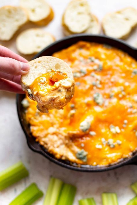 This easy buffalo chicken dip is made in the oven with ranch dressing, cream cheese, Frank's Red Hot sauce, blue cheese, and rotisserie or canned chicken. This will be a BIG HIT at your next party! Chicken Dip Canned Chicken, Buffalo Chicken Dip Canned Chicken, Chicken Dips Crockpot, Buffalo Chicken Dip Oven, Spicy Buffalo Chicken Dip, Chicken Wing Dip, Chicken Buffalo, Dip Recipes Hot, Buffalo Chicken Tacos