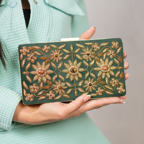 Discover the epitome of elegance with our collection of handmade zardozi embroidery clutches. Each piece is a unique work of art, adorned with intricate patterns and shimmering gemstones, perfect for adding a touch of royal charm to any outfit. #HandmadeElegance #ZardoziEmbroidery #ArtisanCrafts #LuxuryAccessories #TimelessBeauty Zardozi Embroidery, Intricate Patterns, Luxury Accessories, Timeless Beauty, Clutches, Embroidery, Gemstones, Pattern, Art