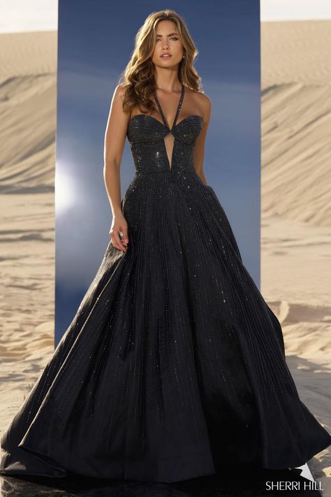 *Adds to Cart* Sherri Hill style 56815 is a showstopper, for sure! The shimmering hot fix ball gown features a fitted bodice with sheer keyhole detail. The straps give the illusion of a halter neckline, but actually criss cross in the back giving the bust some additional support. The sparkling heat stone embellishments adorn every element of the dress from the straps to the skirt, ensuring you'll be glistening all night long! Whether you're planning to wear it under the Friday night lights as you're crowned homecoming queen or while you take the crown at your next pageant, Sherri Hill 56815 is going to have every eye glued on you! Homecoming Queen, Sherri Hill Prom, Princess Sleeves, Sherri Hill Prom Dresses, Prom Dress Stores, Prom Dress Styles, Prom Designs, Designer Prom Dresses, Hot Fix