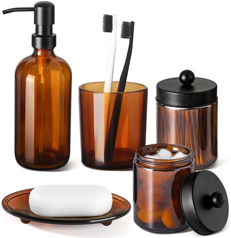 PRICES MAY VARY. Glass 【ATTRACTIVE 5 PACK BATHROOM ACCESSORIES SET】 Get these elegant additions to your bathroom right now! Let these bathroom accessories sets brighten your bathroom nicely! This bathroom accessory set is perfect for every bathroom theme no matter boho, modern, farmhouse, vintage, and western, you name it! You would get a SOAP DISPENSER, a TOOTHBRUSH HOLDER, a COTTON SWAB HOLDER, a COTTON BALL HOLDER, a SOAP DISH, and 6pcs Labels in just ONE set! 【CLASSIC & UNIQUESS AMBER COLOR Western Bathroom Accessories, Southwest Decorating, Bathroom Things, Modern Vintage Bathroom, Brown Bath, Western Bathroom, Glass Bathroom Accessories, Vintage Bathroom Decor, Decor Western