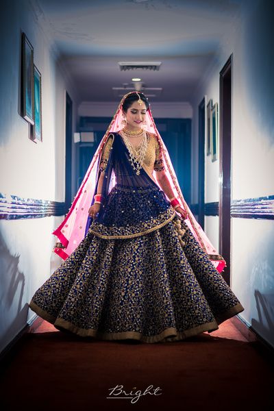 Bridal Lehenga - Navy Blue Wedding Lehenga with Golden Embroidery | WedMeGood | Big Flare Lehenga with Double Dupatta, Pink and Blue with a Beige Choli and Satlada Haar #wedmegood #indianbride #indianwedding #navyblue #pink #bridal #lehenga Blue Bridal Lehenga, Designer Bridal Lehenga Choli, Bridal Lehenga Collection, Indian Bridal Lehenga, Designer Bridal Lehenga, Blue Lehenga, Red Lehenga, Indian Bridal Dress, Indian Bridal Wear